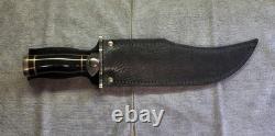 A. Shaw Hunting knife withCustom leather sheath