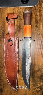 Damascus Steel Hunting Knife with Ornate Handle and Leather Sheath