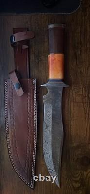Damascus Steel Hunting Knife with Ornate Handle and Leather Sheath