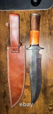 Damascus Steel Hunting Knife with Ornate Handle and Leather Sheath