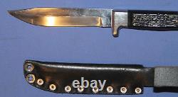 Hunting knife with leather sheath
