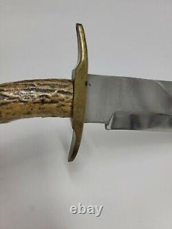 Unbranded hunting knife with custom carved handle Eagle bone/antler