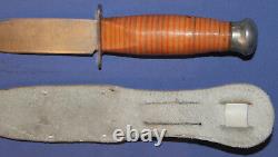 Vintage hunting knife with leather sheath