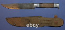 Vintage hunting knife with leather sheath